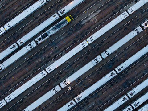 Aerial Close-Up of Trains on Parallel Tracks