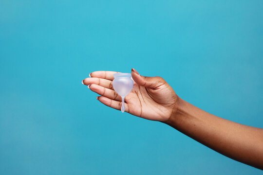 Close up view of woman holding menstrual cup