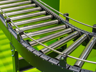 Close-up fragment of conveyor. Instead of turning production line. Conveyor line made of metal...