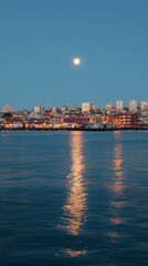 Obraz premium Night cityscape reflected on calm water under a full moon. Serene, peaceful atmosphere.