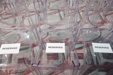 Reserved sign on chairs