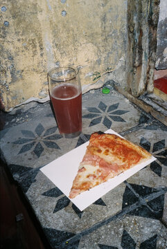 pizza and glass of cherry beer, in Budapest, 35mm