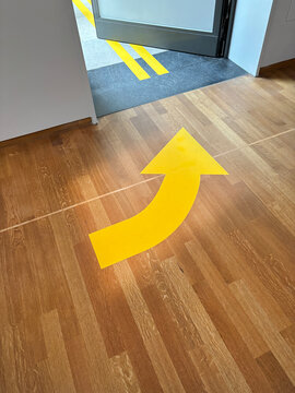 yellow arrow on floor
