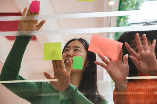 Collaborative brainstorming session with colorful sticky notes
