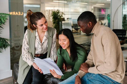Team reviewing documents in modern office environment