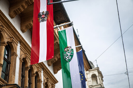 Flags of Austria and flag of Styria (Steiermark), displayed on a building facade in Graz, highlighting regional and national symbols. Styria is an historical region of Austria.