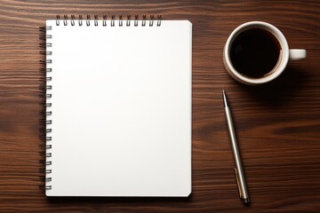 Blank notebook, coffee cup, and pen on wooden table