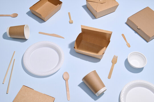 Various Eco-Friendly Packaging Items on a Pastel Blue Background
