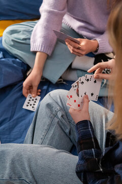 Friends playing cards at home: leisure activity