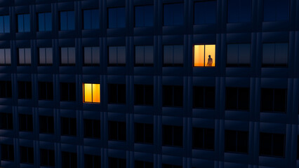 City evening light reveals silhouette of man in window