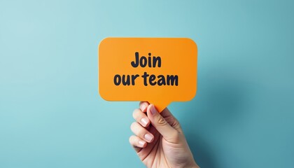 Hand holding yellow speech bubble with text Join team against blue background. Recruitment hiring employment concept. Seeking job position work offers. Human resources, career opportunity, job search.