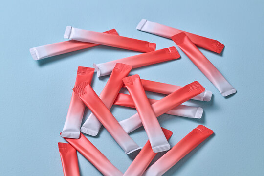 Colorful Sachets Arranged on Pastel Blue Background