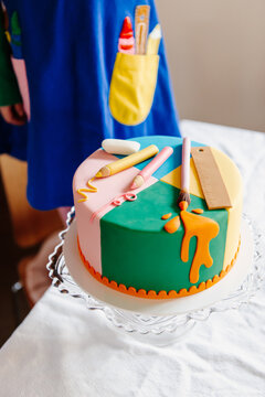 close-up of colorful birthday cake with playful elements