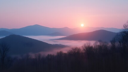 Enchanting sunset casting an orange glow over the mountain range while the sky transitions into vibrant evening hues