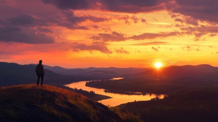 Obraz premium A serene sunset over a winding river, with a silhouette of a person standing on a hill, evoking a sense of tranquility and connection to nature.
