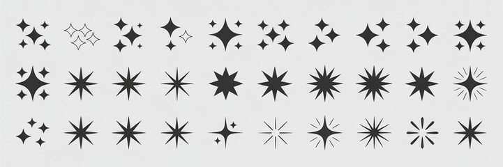 Fototapeta premium Collection of various starburst and sparkle shapes in black on a light background.