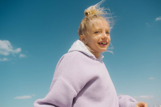 A girl over a blue sky