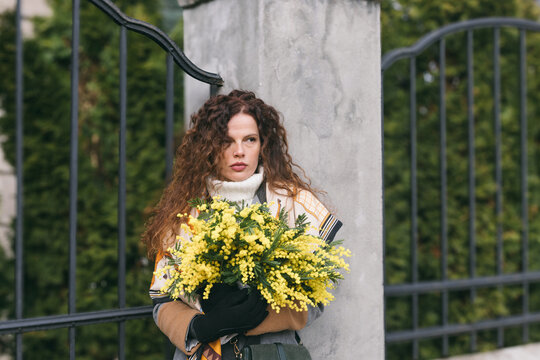 Woman holding mimoses