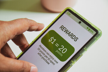 Example of customer loyalty programs in e-commerce. Reward points earned after purchase. Female...