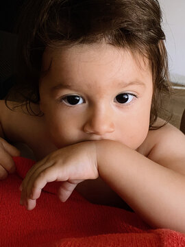 Close-up portrait of a toddler with deep gaze