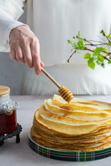 Woman cooking pancakes for breakfast.
