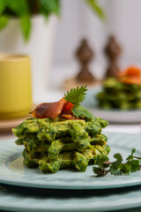 Healthy eating. Spinach and fish waffles for breakfast.