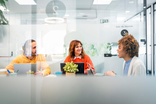 Business people collaborating during meeting in modern office