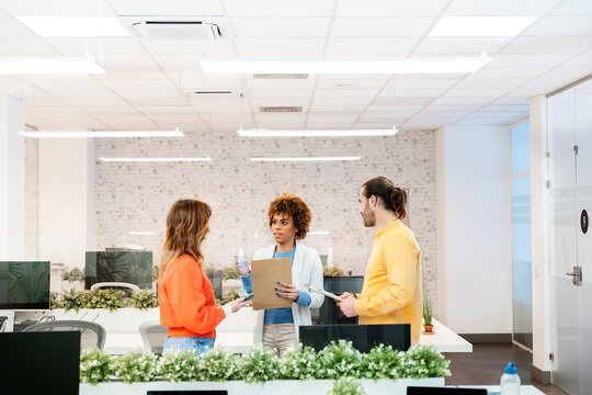 Business people discussing work in modern office