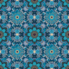 Seamless floral pattern in ethnic style. Beautiful vintage textile print in blue tones.