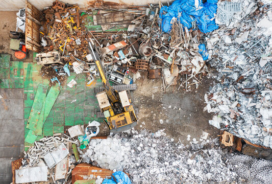 Aerial View of Resource Recycling Plant with Excavator and Waste