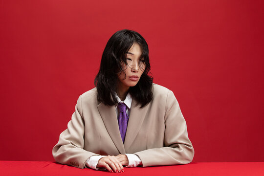 Fashion portrait of asian woman in suit 