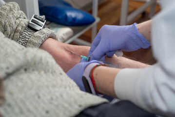Nurse taking blood from a patient's vein