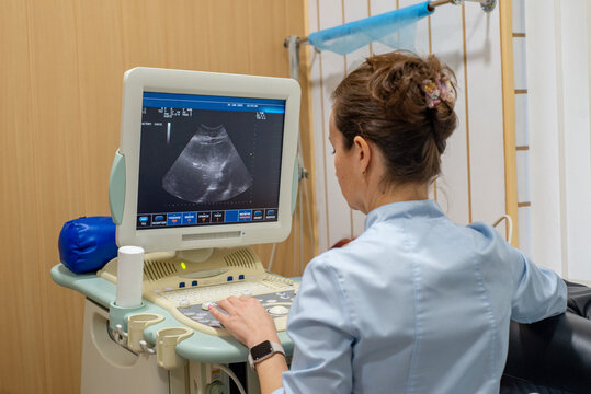 Faceless Doctor does an ultrasound of the abdomen