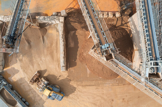 Aerial view of sand and gravel plant with conveyor belts.