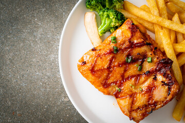 grilled chicken steak with potato chips or french fries