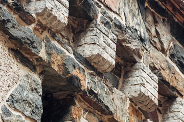 The wall is made of stone and has a rough texture