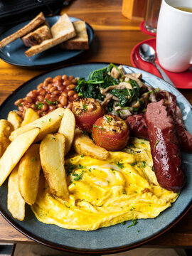 Generous brunch with sausage and scrambled eggs