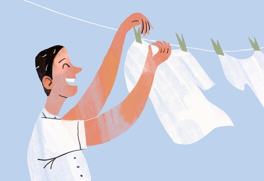 Man hangs washed clean white laundry