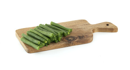Fresh Green Beans on a Wooden Cutting Board Against a White Background