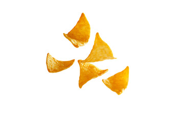 Naklejka premium Golden Tortilla Chip Fragments Falling on White