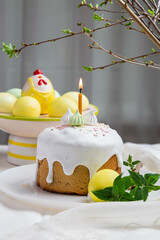 Easter. On the festive table there is Easter cake and painted eggs.