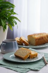 Two pieces of fresh cake on a plate.