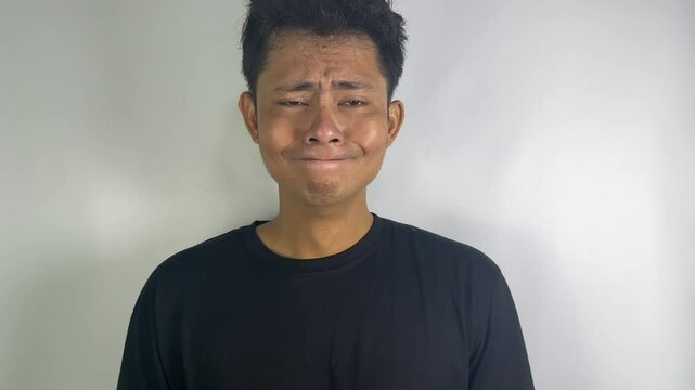Man in Black T-Shirt Against White Background Showing Various Facial Expressions - Emotion Concept Series
