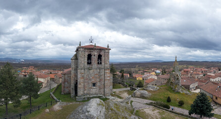 Charming Village with Ancient Stone Tower and Clouds