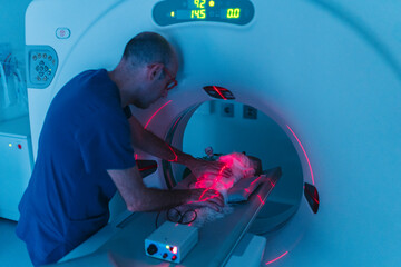 Veterinarian preparing a dog for a CT scan in a veterinary clinic