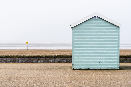 Painted beach hut in winter