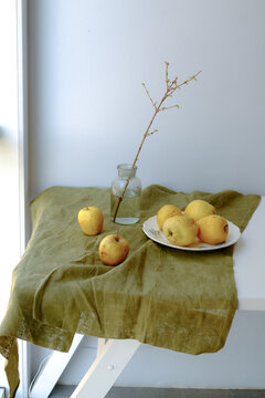 still life with yellow apples