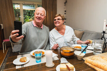 Cheerful senior couple taking a selfie 