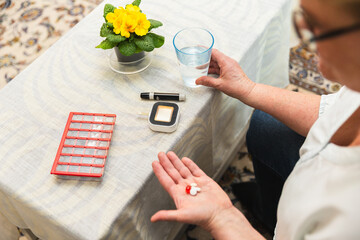 Senior woman taking daily medication