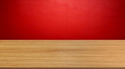 Empty wooden table on red wall background.